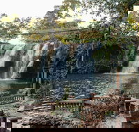 Mena Creek Falls - Tourism Guide