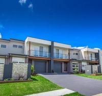 Escape At Nobbys Executive Townhouse 1 74 Pacific Drive - Travel Agents