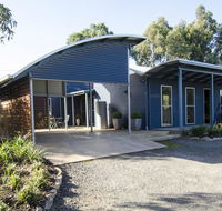 Corrugated Cottage - Travel Agents